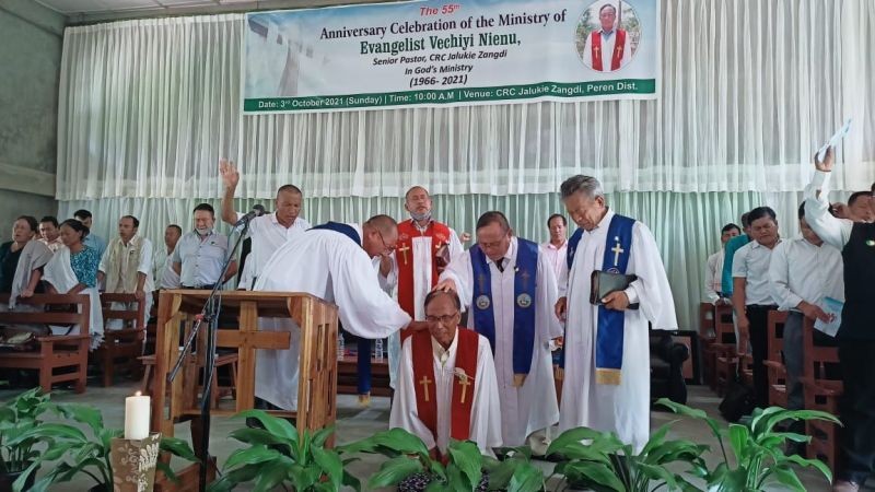 NCRC church leaders praying for Evangelist Vechiyi Neinu during the anniversary celebration on October 3.
